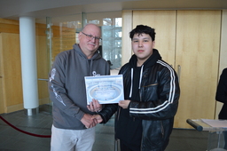 Leonard Beaulieu (Youth Parliamentarian MLA Tu Nedhé-Wiilideh) receiving certificate of participation from Speaker, Honourable Shane Thompson (MLA Nahendeh).