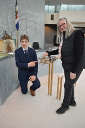 Hunter Groenewegen (Youth Parliamentarian MLA Hay River North) and Jane Groenewegan (grandmother) former Member of the Northwest Territories Legislative Assembly pointing at the diamond in the Mace.