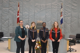 PH 531 - Page Photograph : Member Kate Reid, MLA for Great Slave and Pages Gabrielle Tink, Sokhna Momy Bousso, and Olivier Barrieau